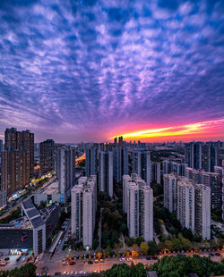 High angle view of buildings against sky during sunset