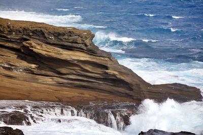 Waves splashing on rock formation