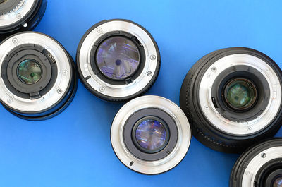 High angle view of lens on blue background