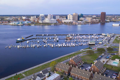 High angle view of harbor and buildings in city