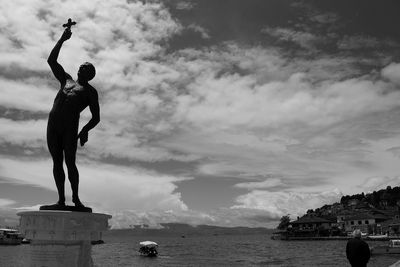 Statue of liberty against cloudy sky