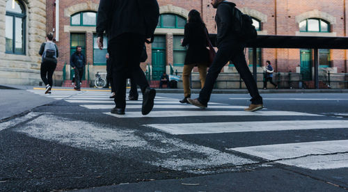 People crossing road in city