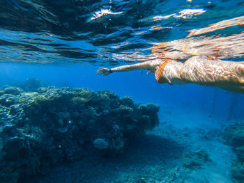 Woman snorkeling in sea