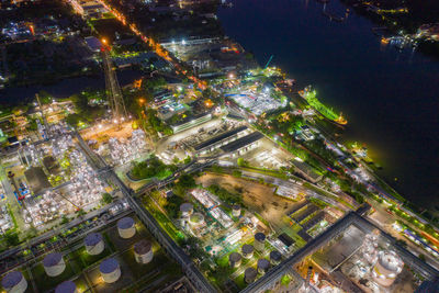 High angle view of city lit up at night