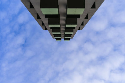 Low angle view of modern building against blue sky