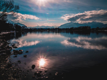 Scenic view of lake against sky during sunset