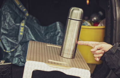 High angle view of person holding book