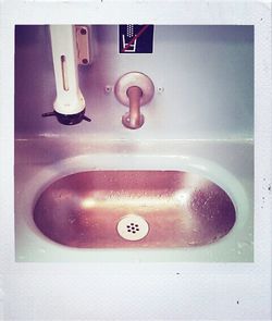 Close-up of faucet in bathroom