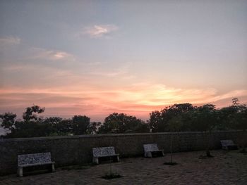 Trees against sky during sunset