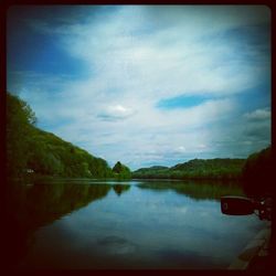 Reflection of trees in calm lake