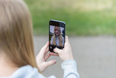 Close-up of woman using mobile phone