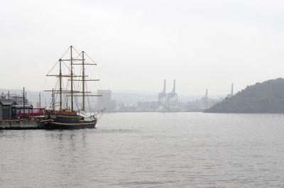 Boats moored at harbor