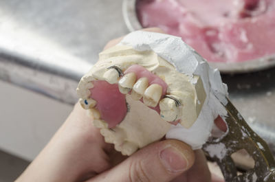 Close-up of hand holding ice cream