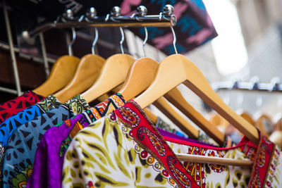 Close-up of multi colored shoes hanging on display at store