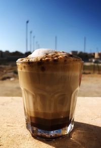 Close-up of coffee on table against clear sky