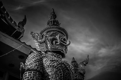 Low angle view of statue against sky