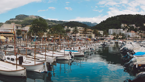 Boats moored at harbor