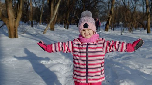 Child standing outdoors during winter