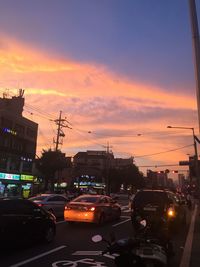 View of city street at sunset