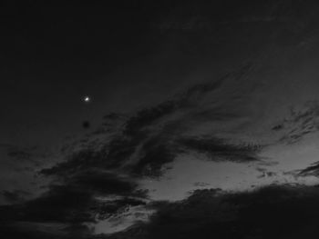 Low angle view of moon in sky at night