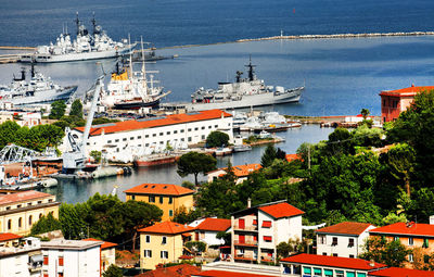 High angle view of residential buildings by sea