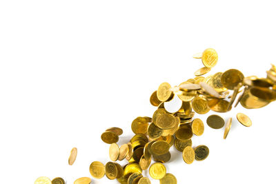 Close-up of coins against white background