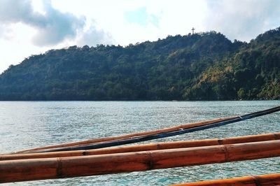 Scenic view of lake against cloudy sky