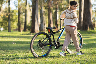 Portrait of child and his bicycle