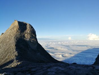 Scenic view of mountain against blue sky