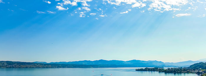 Scenic view of sea against blue sky