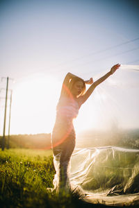 Full length of woman on field against sky