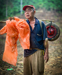 Full length of man standing in forest