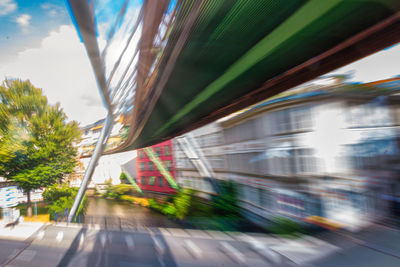 Blurred motion of road against sky in city