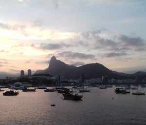 View of harbor against cloudy sky