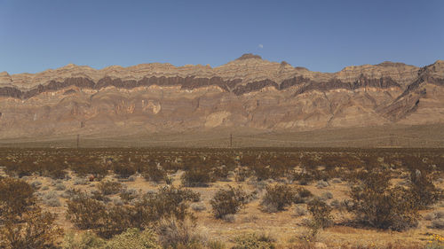 Scenic view of desert against clear sky