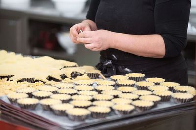 Midsection of person preparing food