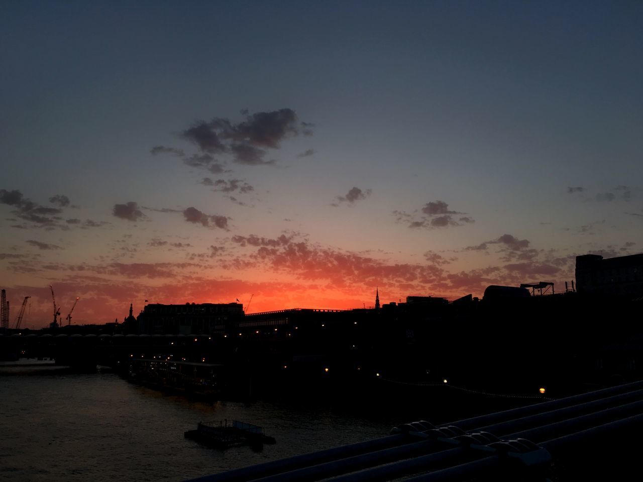 SILHOUETTE BUILDINGS AGAINST SKY AT SUNSET