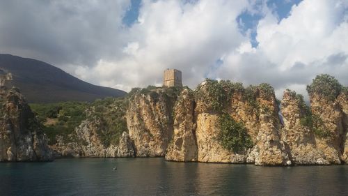 Panoramic view of sea and buildings against sky