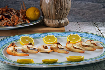 High angle view of fruits in plate on table