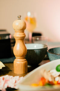Close-up of salt shaker on table