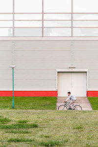 Bicycle parked against brick wall