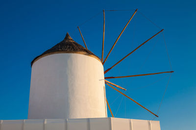 Antique traditional windmills in the city of oia at santorini island