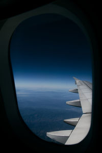 View of airplane wing through window