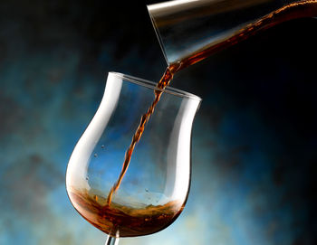 Close-up of wine glass against white background