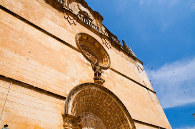 Low angle view of temple on building against sky