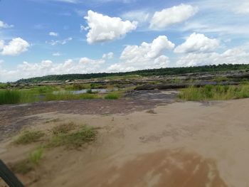 Scenic view of land against sky