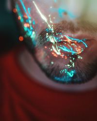 Close-up of lights on bearded man mouth