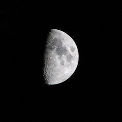 Low angle view of moon against sky at night