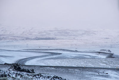 Scenic view of snow covered beach