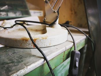 Close-up of equipment with cable on table